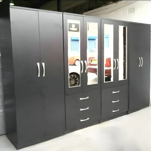 Good looking 8 door wardrobe with drawer and mirror, guarantee